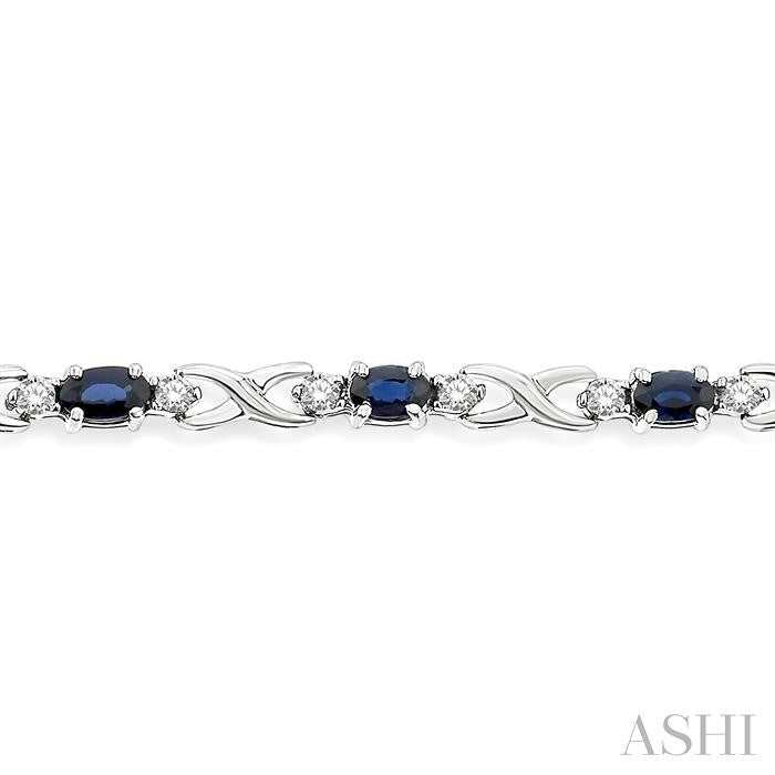 5X3 MM Oval Cut Sapphire and 1/10 Ctw Round Cut Diamond Bracelet in 10K White Gold