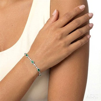5X3 MM Oval Cut Emerald and 1/20 Ctw Round Cut Diamond Bracelet in 10K White Gold