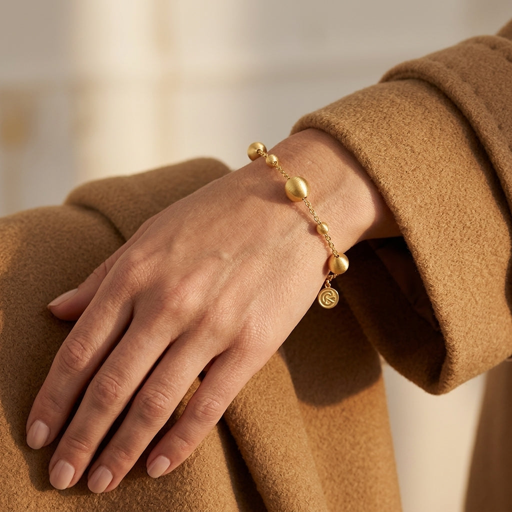 Gabriel & Co. 14K Yellow Plain Gold Bujukan Ball Station Bracelet - worn lifestyle photo