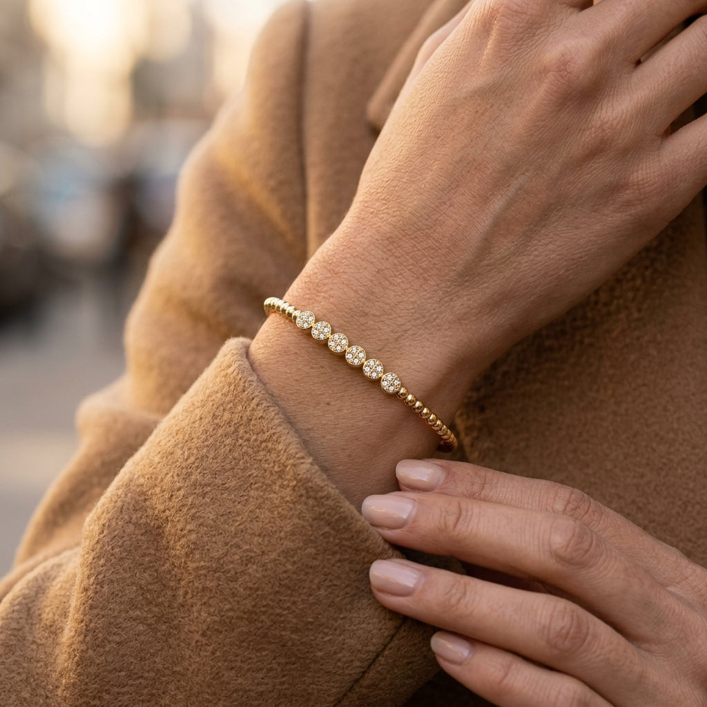 Gabriel & Co. 14K Yellow Gold Bujukan Bead and Cluster Diamond Bangle .14CTW SZ 6 - worn lifestyle photo