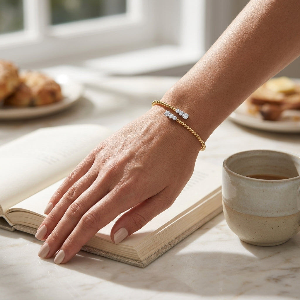 Gabriel & Co. 14K White-Yellow Gold Bujukan Graduating Diamond Bypass Bangle SZ 6.25 .42CTW - worn lifestyle photo