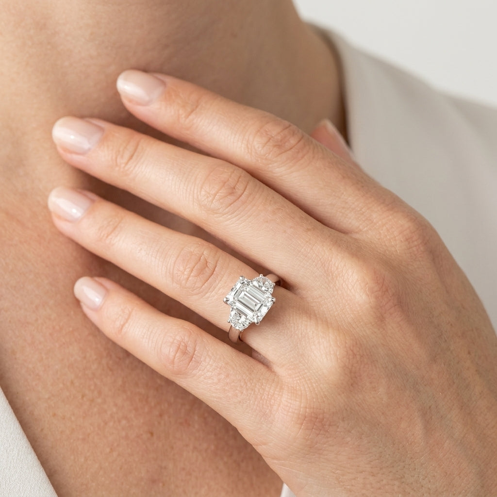 3-Stone Round & Emerald Cut Engagement Ring - worn lifestyle photo