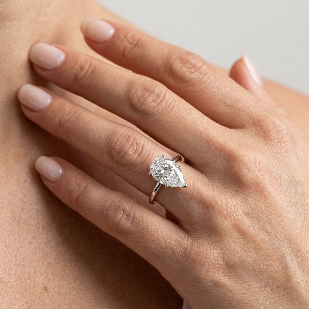 Pear Shaped Hidden Halo Engagement Ring - worn lifestyle photo