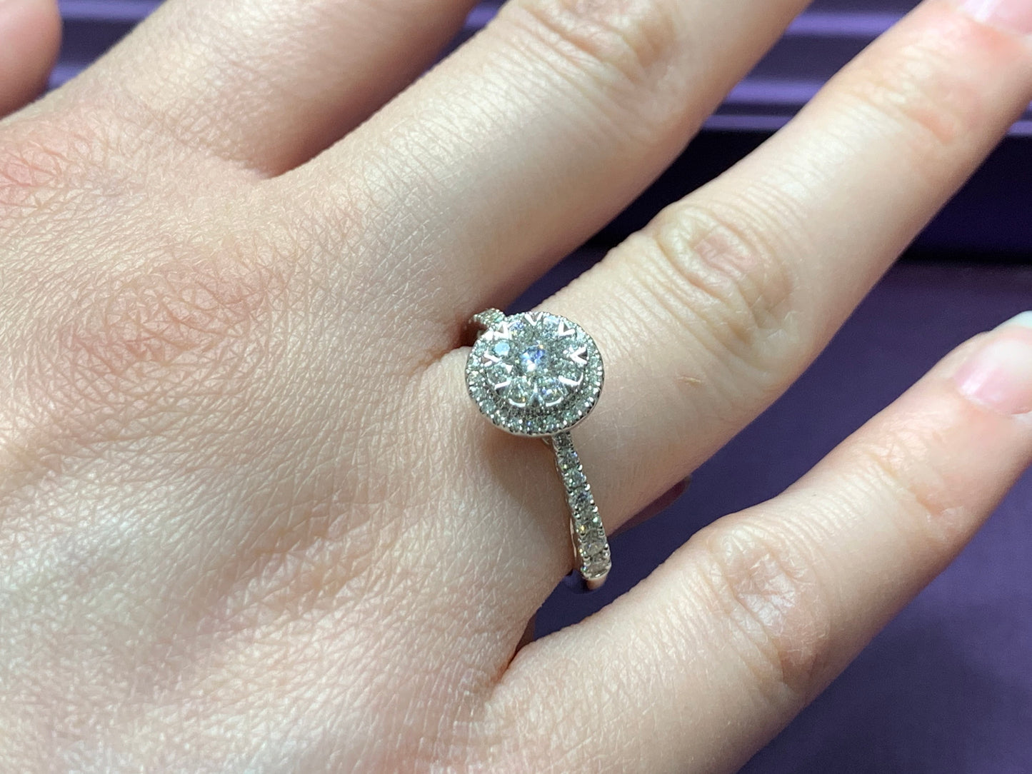 14kt white Gold with 3/4ctw round diamonds with two halos and one round solitaire