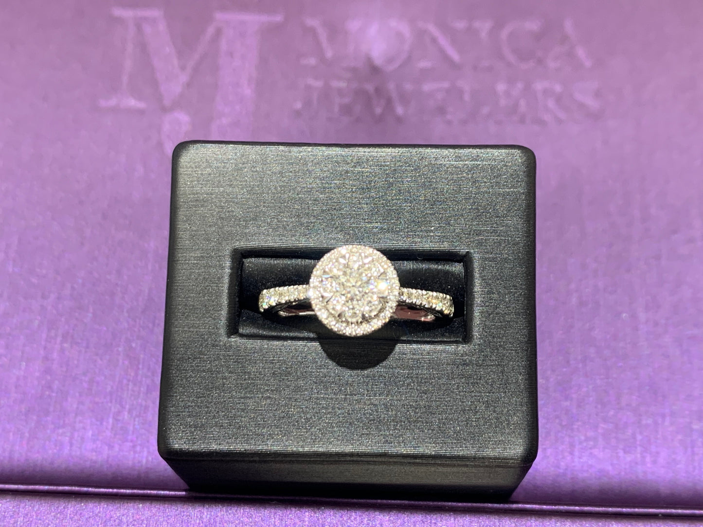 14kt white Gold with 3/4ctw round diamonds with two halos and one round solitaire