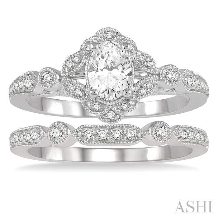 3/4 Ctw Round Cut Diamond Wedding Set With 5/8 Ctw Oval Cut Floral Engagement Ring and 1/10 Ctw Lattice Wedding Band in 