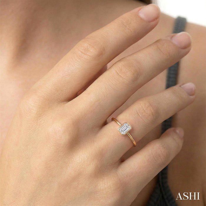 1/6 Ctw Petite Bezel Set Emerald Cut Diamond Fashion Ring in 10K Yellow Gold