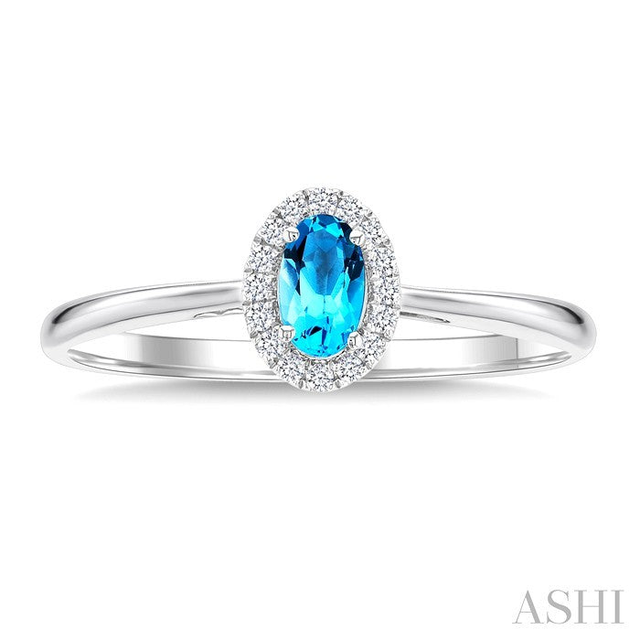 5X3 MM Oval Shape Blue Topaz and 1/20 Ctw Round Cut Diamond Halo Semi-Precious Ring in 10K White Gold