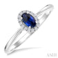 5X3 MM Oval Shape Sapphire and 1/20 Ctw Round Cut Diamond Halo Precious Ring in 10K White Gold