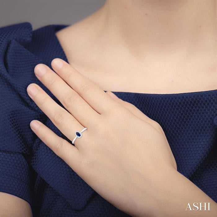 5X3 MM Oval Shape Sapphire and 1/20 Ctw Round Cut Diamond Halo Precious Ring in 10K White Gold