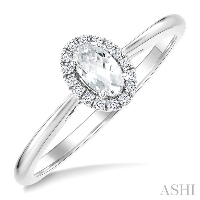 5X3 MM Oval Shape White Topaz and 1/20 Ctw Round Cut Diamond Halo Semi-Precious Ring in 10K White Gold