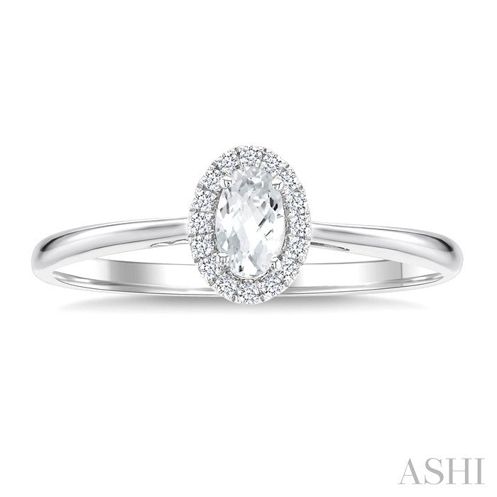 5X3 MM Oval Shape White Topaz and 1/20 Ctw Round Cut Diamond Halo Semi-Precious Ring in 10K White Gold
