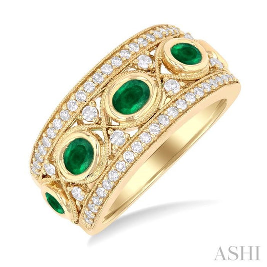 4X3 MM Oval and 2.8 MM Round Cut Emerald and 3/8 Ctw Curvy Criss Cross Round Cut Diamond Precious Band in 14K Yellow Gol