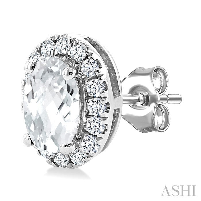 5X3 MM Oval Shape White Topaz and 1/8 Ctw Round Cut Diamond Halo Semi-Precious Stud Earrings in 10K White Gold
