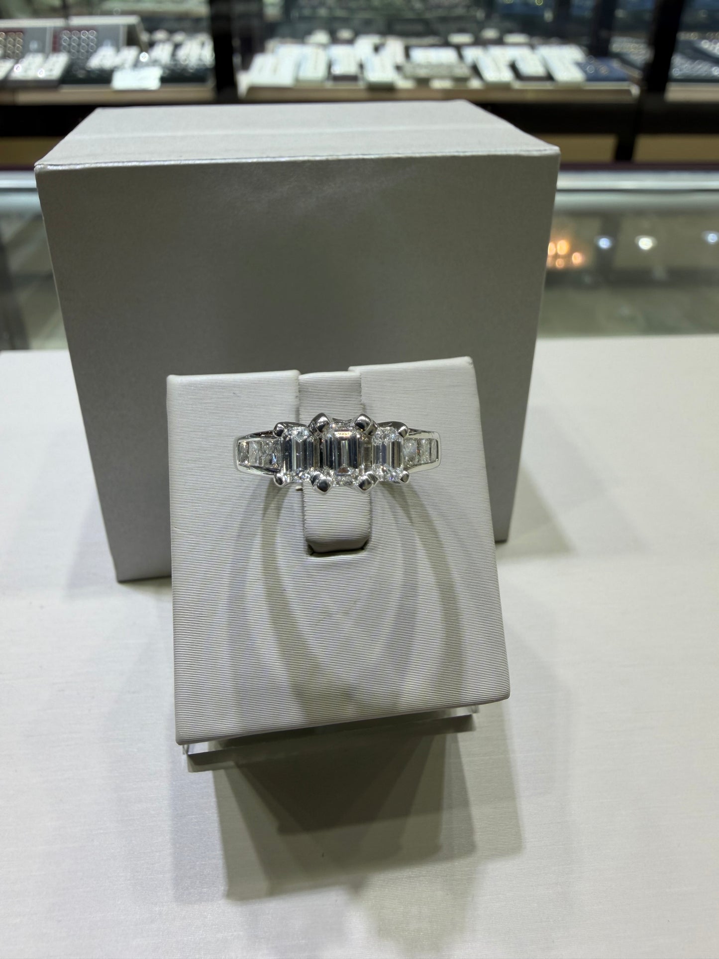 1.49 CTW Certified Emerald-Cut Three-Stone Diamond Ring with Princess-Cut Accents | Monica Jewelers