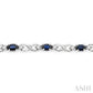 5X3 MM Oval Cut Sapphire and 1/10 Ctw Round Cut Diamond Bracelet in 10K White Gold