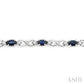 5X3 MM Oval Cut Sapphire and 1/10 Ctw Round Cut Diamond Bracelet in 10K White Gold
