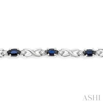 5X3 MM Oval Cut Sapphire and 1/10 Ctw Round Cut Diamond Bracelet in 10K White Gold