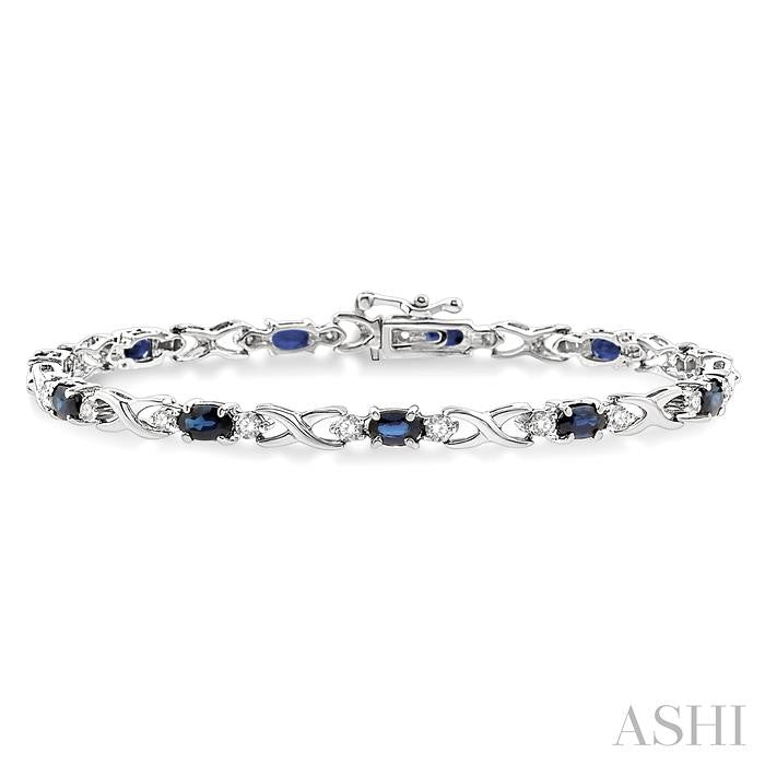 5X3 MM Oval Cut Sapphire and 1/10 Ctw Round Cut Diamond Bracelet in 10K White Gold