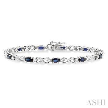 5X3 MM Oval Cut Sapphire and 1/10 Ctw Round Cut Diamond Bracelet in 10K White Gold