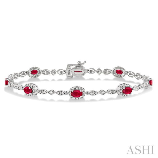 5X3 MM Oval Cut Ruby and 1/20 Ctw Round Cut Diamond Bracelet in 14K White Gold