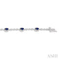 5X3 MM Oval Cut Sapphire and 1/20 Ctw Round Cut Diamond Bracelet in 14K White Gold