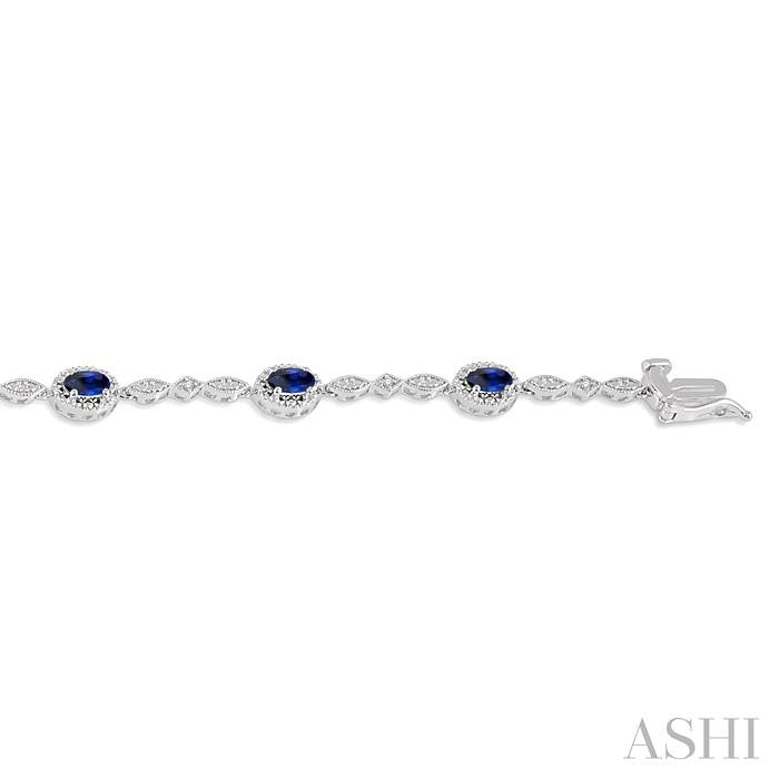 5X3 MM Oval Cut Sapphire and 1/20 Ctw Round Cut Diamond Bracelet in 14K White Gold
