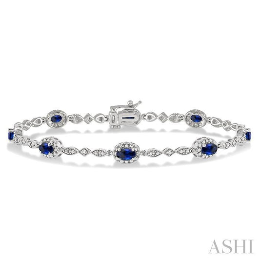 5X3 MM Oval Cut Sapphire and 1/20 Ctw Round Cut Diamond Bracelet in 14K White Gold