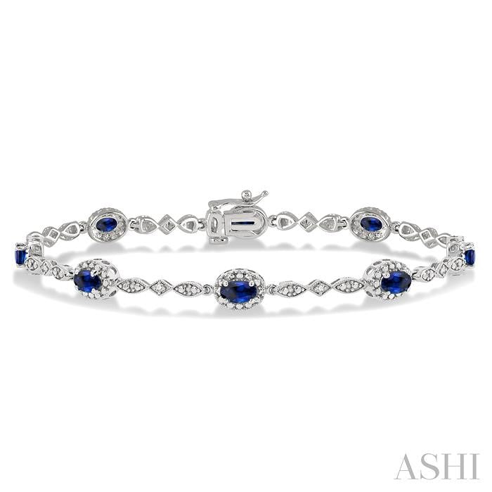 5X3 MM Oval Cut Sapphire and 1/20 Ctw Round Cut Diamond Bracelet in 14K White Gold