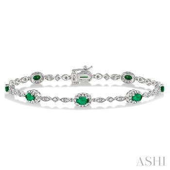 5X3 MM Oval Cut Emerald and 1/20 Ctw Round Cut Diamond Bracelet in 10K White Gold