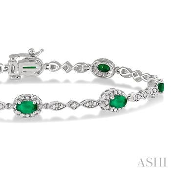 5X3 MM Oval Cut Emerald and 1/20 Ctw Round Cut Diamond Bracelet in 10K White Gold