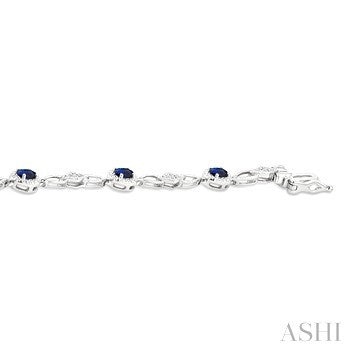 1/20 Ctw Oval Cut 4X3 MM Sapphire and Round Cut Diamond Precious Fashion Bracelet in 10K White Gold