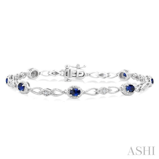 1/20 Ctw Oval Cut 4X3 MM Sapphire and Round Cut Diamond Precious Fashion Bracelet in 10K White Gold