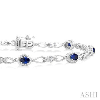 1/20 Ctw Oval Cut 4X3 MM Sapphire and Round Cut Diamond Precious Fashion Bracelet in 10K White Gold