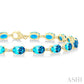 6X4 MM Oval Cut Blue Topaz and 1/6 Ctw Round Cut Diamond Semi-Precious Tennis Bracelet in 10K Yellow Gold
