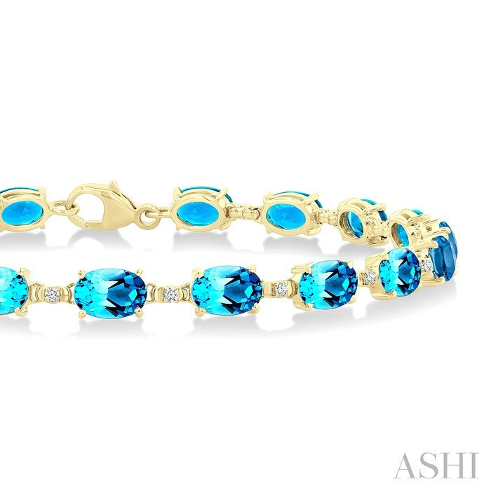 6X4 MM Oval Cut Blue Topaz and 1/6 Ctw Round Cut Diamond Semi-Precious Tennis Bracelet in 10K Yellow Gold