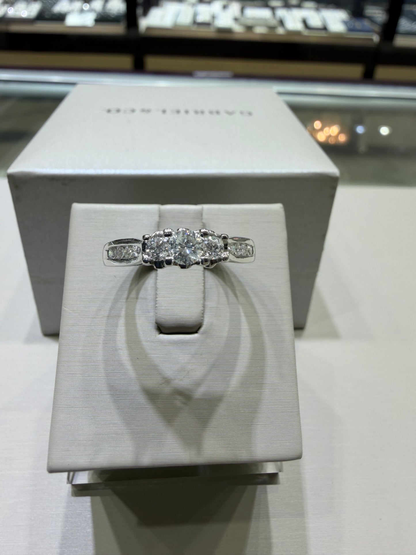 14K White Gold Three-Stone Diamond Engagement Ring with Peekaboo Diamonds – 0.75 CTW