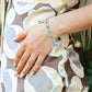 6X4 MM Oval Cut Blue Topaz and 1/10 Ctw Round Cut Diamond Semi-Precious Bracelet in Sterling Silver