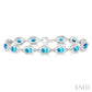 6X4 MM Oval Cut Blue Topaz and 1/10 Ctw Round Cut Diamond Semi-Precious Bracelet in Sterling Silver