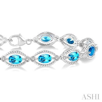 6X4 MM Oval Cut Blue Topaz and 1/10 Ctw Round Cut Diamond Semi-Precious Bracelet in Sterling Silver