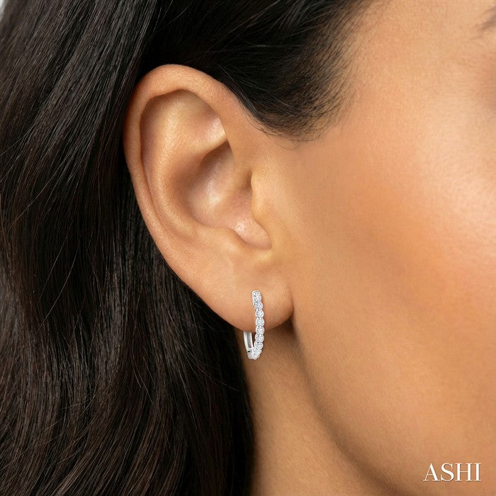 1/6 Ctw Petite Shared Prong Round Cut Diamond Hoop Earrings in Sterling Silver