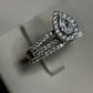 Romantic 14K white gold pear halo wedding set with .25ct center and 1ct total diamonds. Elegant sparkle and timeless beauty