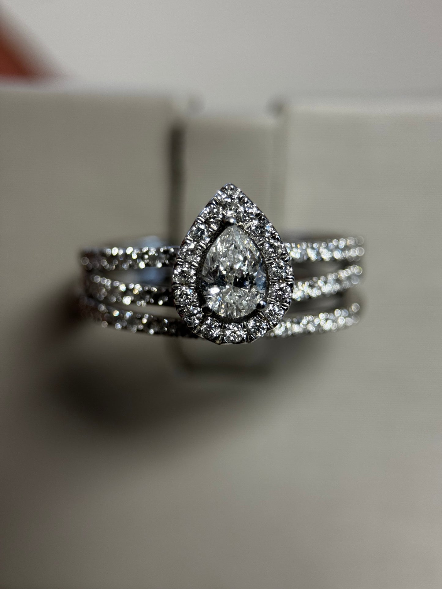 Romantic 14K white gold pear halo wedding set with .25ct center and 1ct total diamonds. Elegant sparkle and timeless beauty