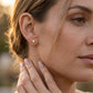 Gabriel & Co. 14K Yellow Gold Bujukan and White Sapphire Stud Earrings .16CTW - worn lifestyle photo