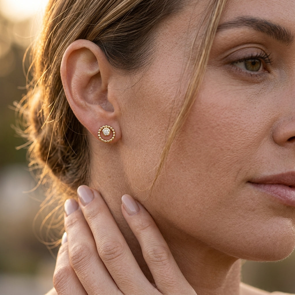 Gabriel & Co. 14K Yellow Gold Bujukan and White Sapphire Stud Earrings .16CTW - worn lifestyle photo