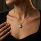 Gabriel & Co. 14K Yellow Gold Teardrop Blue Topaz Pendant Necklace - worn lifestyle photo