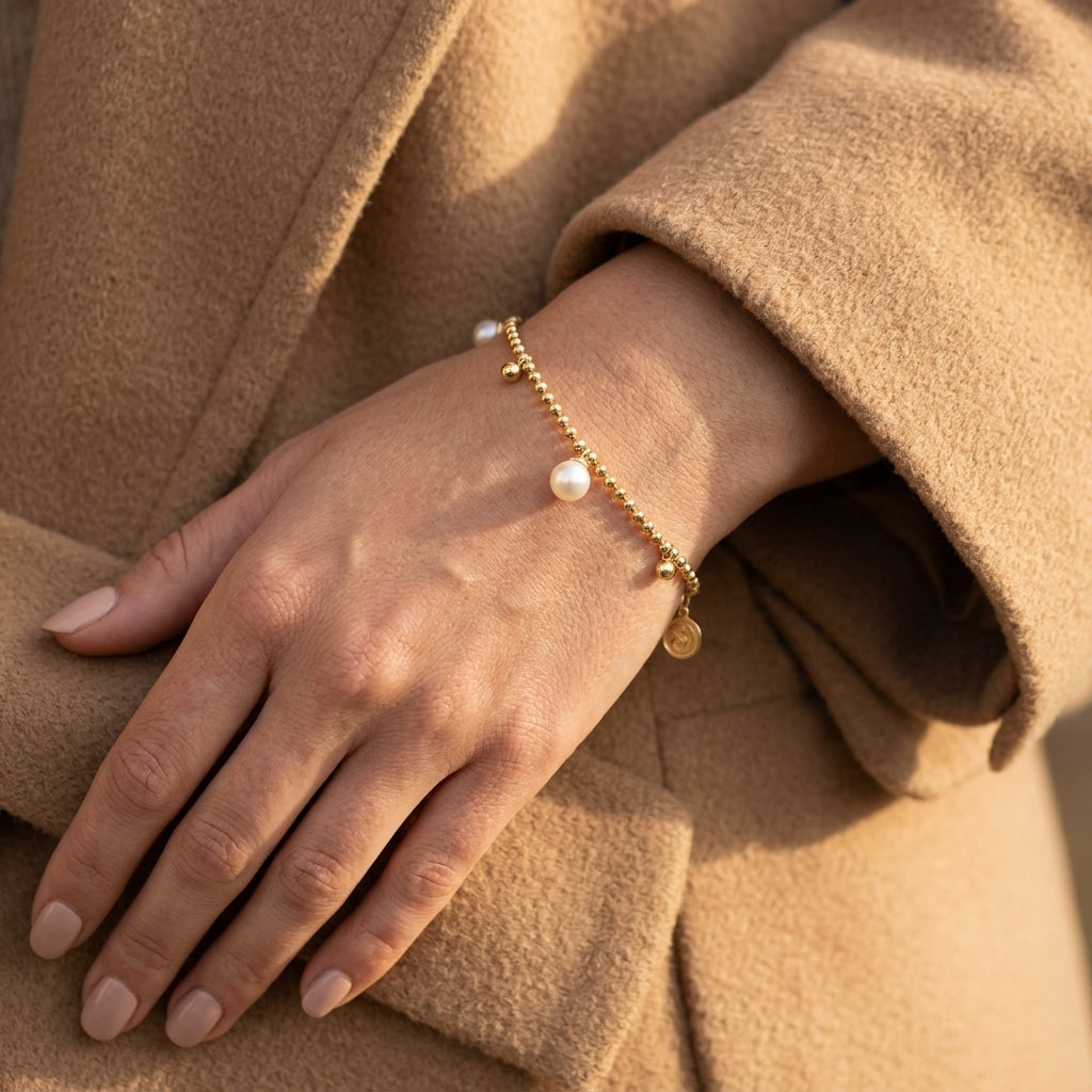 Gabriel & Co. 14K Yellow Gold Bujukan Beads and Pearl Droplet Bracelet - worn lifestyle photo