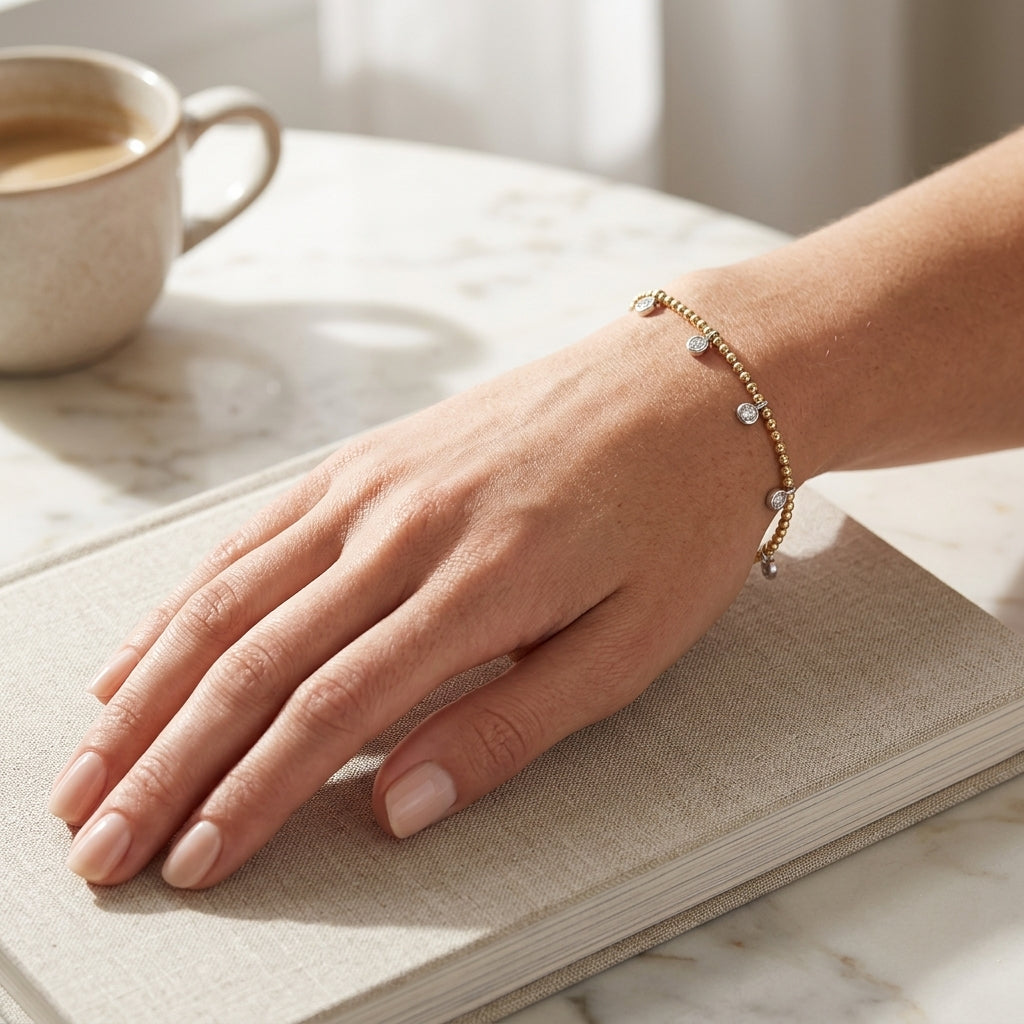 Gabriel & Co. 14K White and Yellow Gold Bujukan White Sapphire Droplet Bracelet - worn lifestyle photo