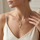 Gabriel & Co. 14K Yellow Gold Diamond Cut Wing Shape Pendant Necklace .16CTW - worn lifestyle photo