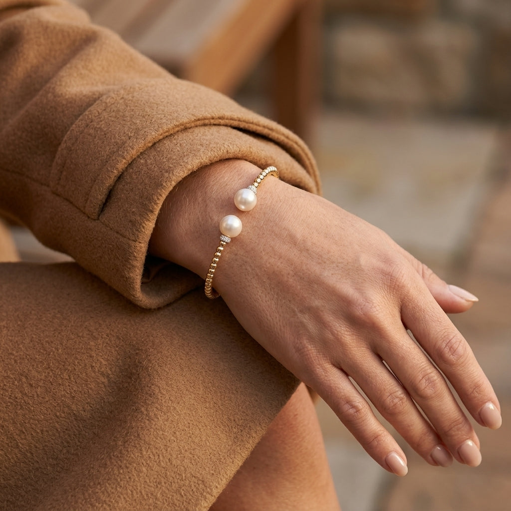Gabriel & Co. 14K Yellow Gold Bujukan Diamond and Pearl Split Bangle .05CTW SZ 6 - worn lifestyle photo